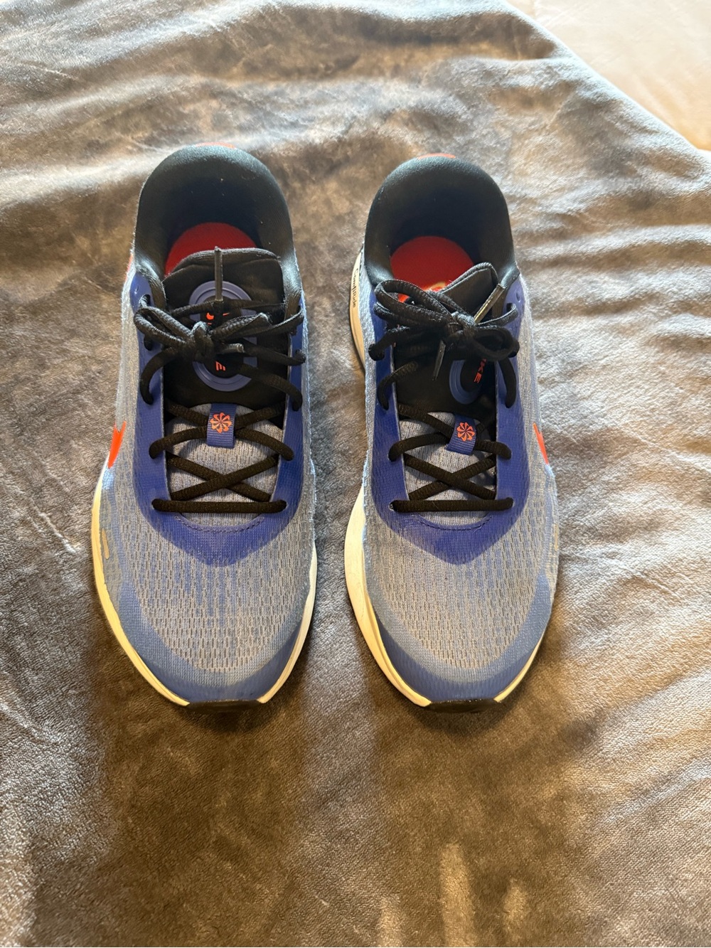 Nike Men's Blue and Black Running Shoes with Orange Swoosh